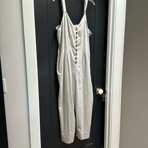 New with tags, Universal khaki jumpsuit with wood buttons and hidden zipper